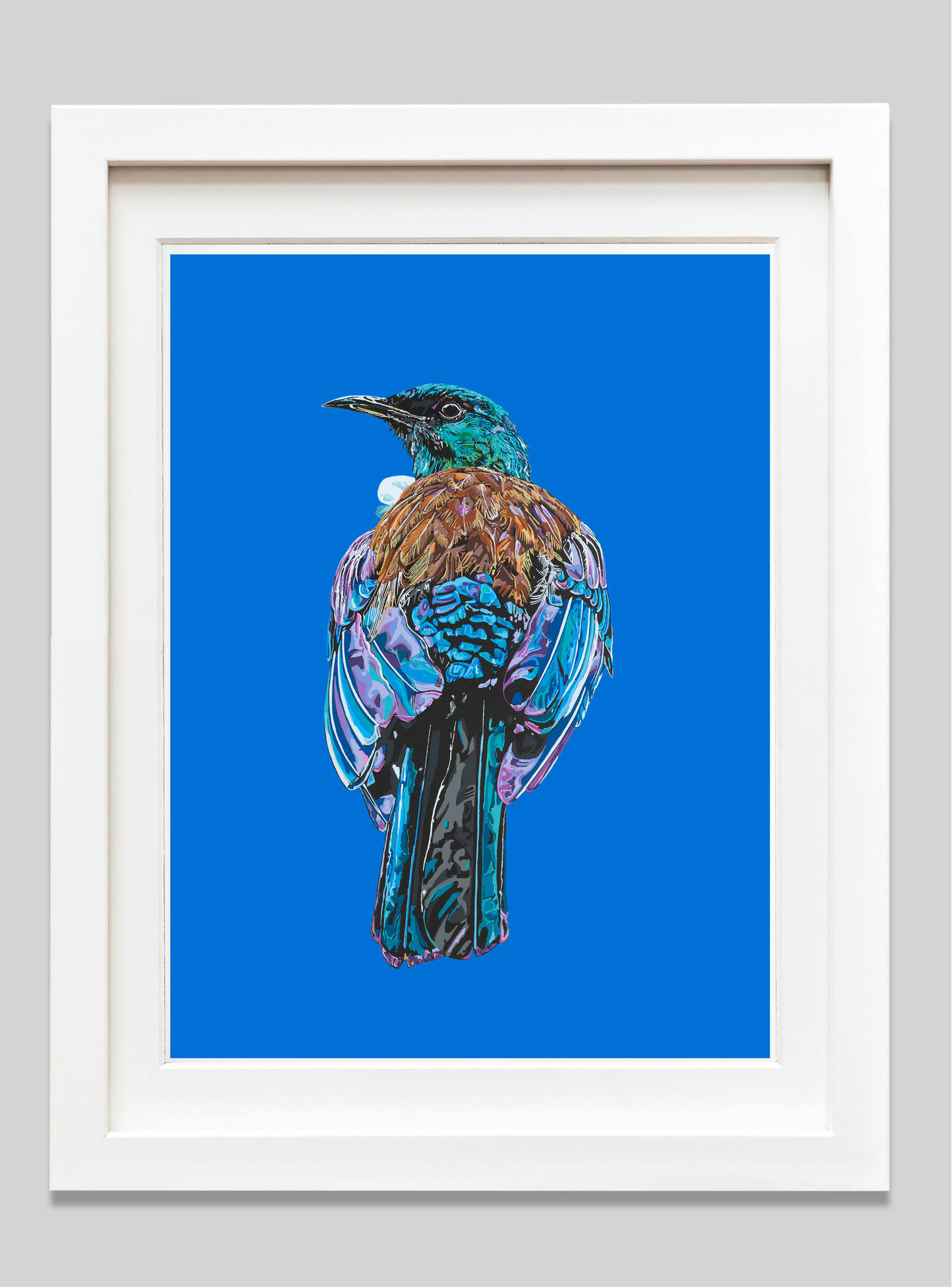 Framed artwork of a colorful bird on a blue background