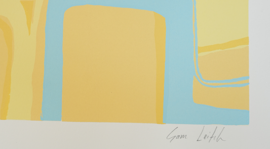 An abstract minimalist artwork featuring soft, organic shapes in shades of mustard yellow and light blue, signed "Sam Leitch" in the bottom right corner.