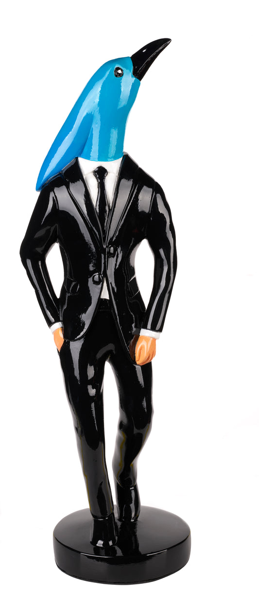 Statue of a bird in a black suit with a blue head on a white background