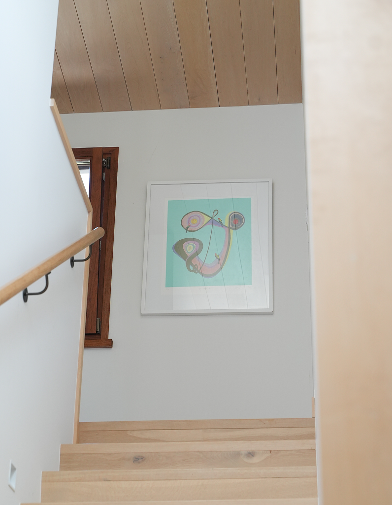 Staircase with a framed abstract artwork on the wall